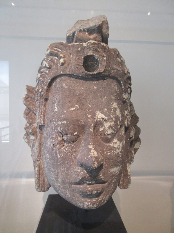 Stone head of the Maya maize god from Copan